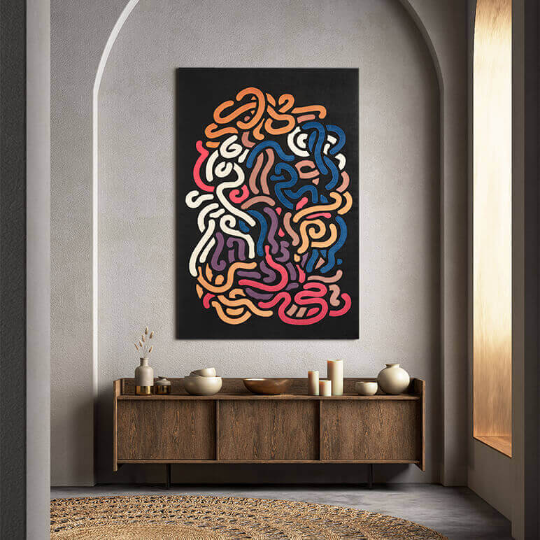 Colorful abstract art on a wall above a wooden console table.