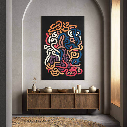Colorful abstract art on a wall above a wooden console table.