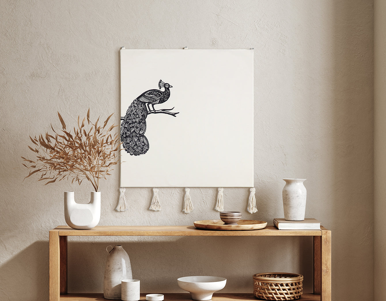 Decorative setup with a peacock wall hanging on a wall above a wooden console table.