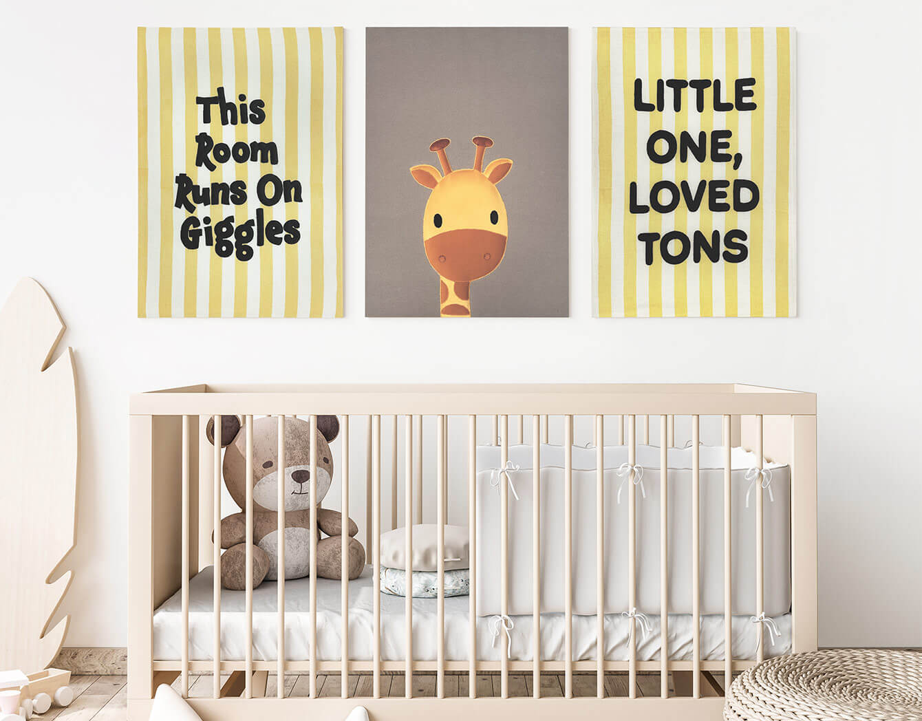 organic nursery room with some playful typographic and animal themed wall art pieces