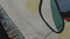 video showcasing the weave on a jacquard woven cotton throw blanket featuring a playing card inspired design