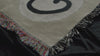pan video showcasing the weave on a jacquard woven playing card inspired cotton throw blanket
