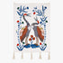 Songs of the Crane embroidered wall hanging—two stylized cranes with floral vines in blue, rust and green on an ivory textile, finished with tassels on a white background
