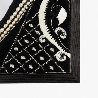 Black and white embroidered fabric with pearl embellishments