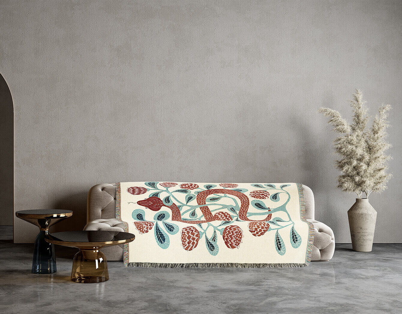 Decorative blanket with a snake pattern draped over a sofa in a modern living room.
