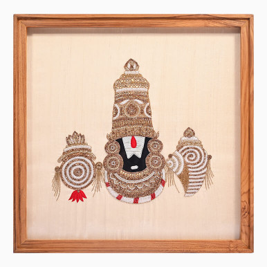Textile artwork of Lord Venkateswara, hand-embroidered using beads, crystals, French purl wire and silk thread over a cream raw silk background, framed in wood