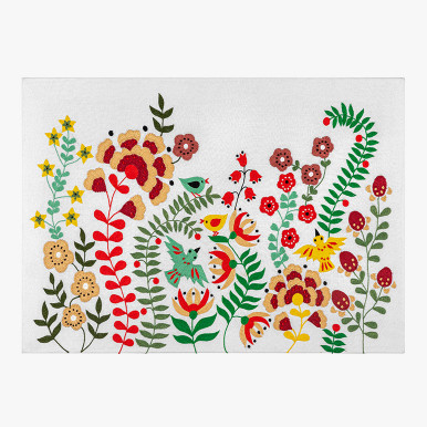 wildflower wall art with embroidered colorful birds and plants over a white cotton fabric