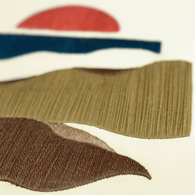 Embroidery details on an abstract wool embroidered artwork in earthy color tones