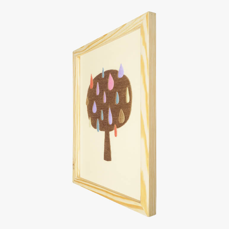 Right angle view of an abstract tree wall art, framed in wood