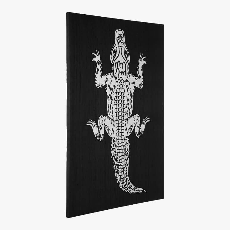 framed alligator art in black and white showing a life size alligator embroidered in patchwork