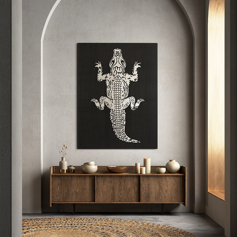 framed textile art featuring a life sized alligator created using black and white patchwork and embroidery