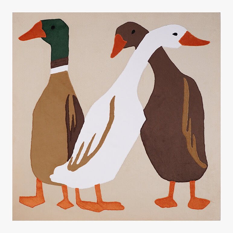 Feature image of a textile artwork showcasing three multicolored ducks over a beige background