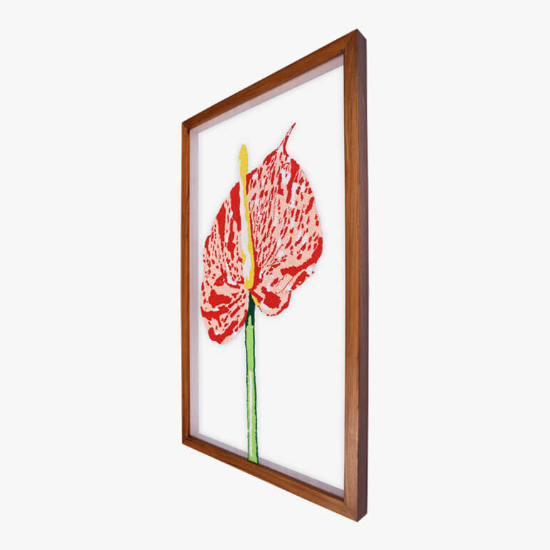 Angled view of a framed art with flowers featuring the Shibori Anthurium