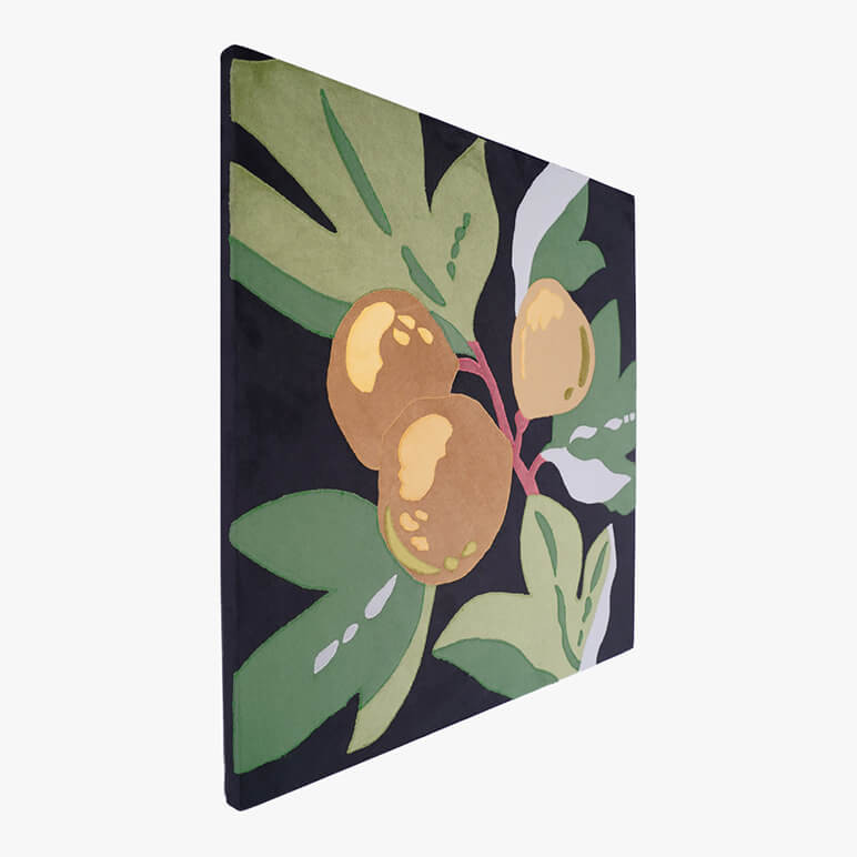 Left angle view of a canvas framed artwork of fruit in black, green and golden color tones
