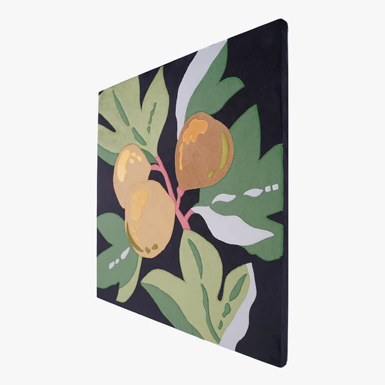 Right angle view of a canvas framed artwork of fruit in black, green and golden color tones