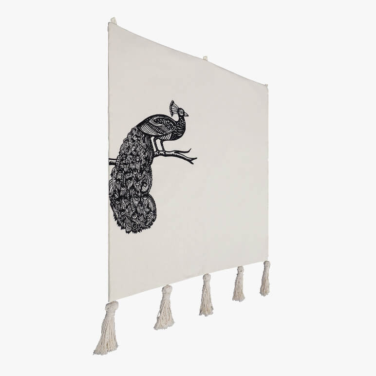 side angle view of a bird art tapestry featuring a minimalistic line art of a peacock on one side of a beige colored tapestry background