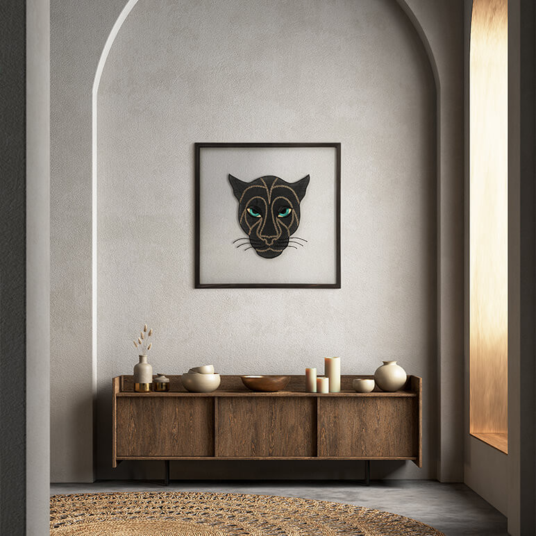 framed black panther textile art seen displayed in a modern grey entryway