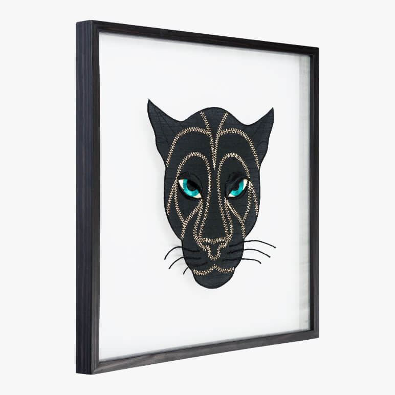 framed black panther art featuring an embroidered panther head seen from the side