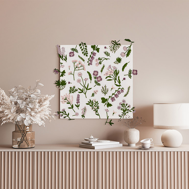 framed white canvas wall art with stumpwork botanicals embroidered on it