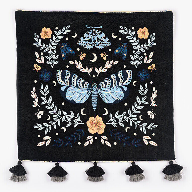 butterfly tapestry in black blue and peach featuring moths and butterflies along with botanical elements and flowers