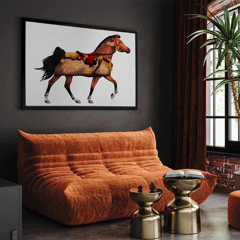 framed carousel horse art seen in a dark living room with an orange sofa