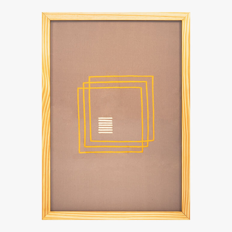 framed chic textile wall art in earthy color tones of brown and orange with simple geometric shapes on it