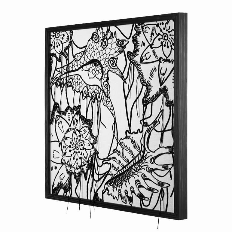 side view of a monochrome framed textile artwork featuring abstract seashells embroidered in black wool