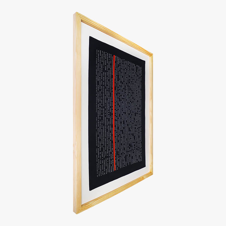 angled image of a framed textile wall art in black and white done in the abstract style of modern art