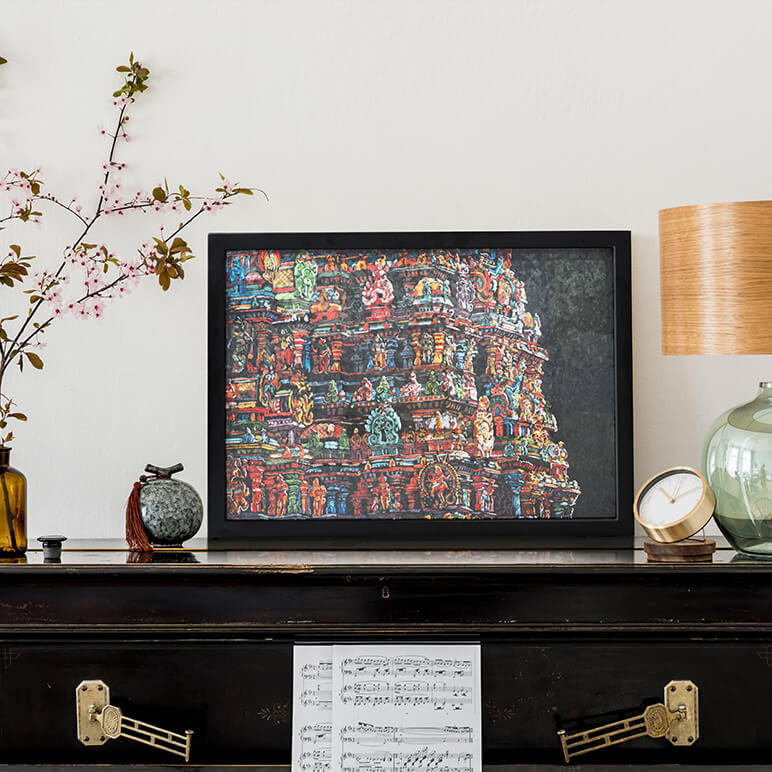 framed black cultural wall art featuring a colorful Indian temple