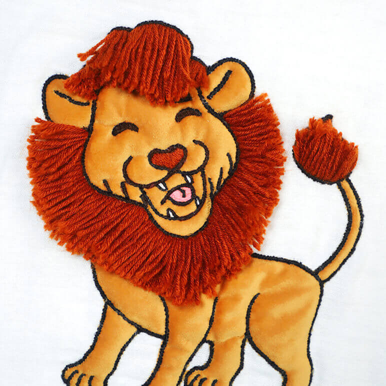 closeup view of a laughing lion with orange woollen mane