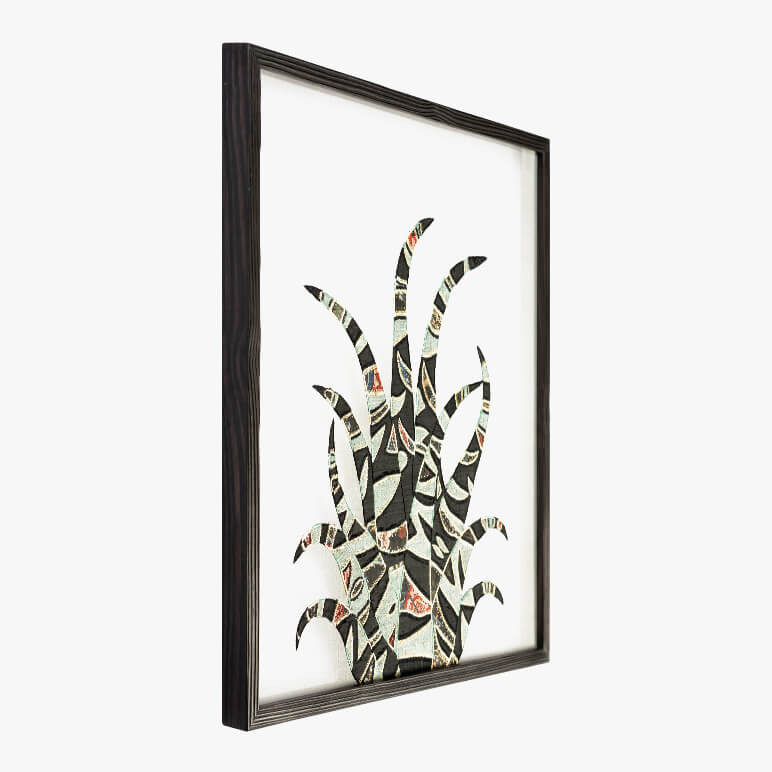 side view of a framed desert themed wall art piece featuring a black and grey cactus