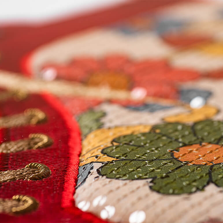 closeup view of the sequins on a textile wall artwork in multicolors