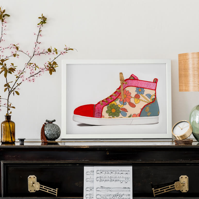 an eccentric home décor piece with a textile artwork seen framed above a piano