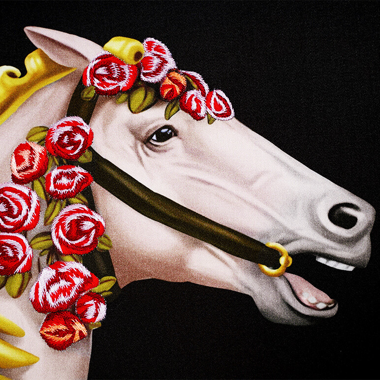 closeup embroidery detail seen on a horse's head in an extra large art