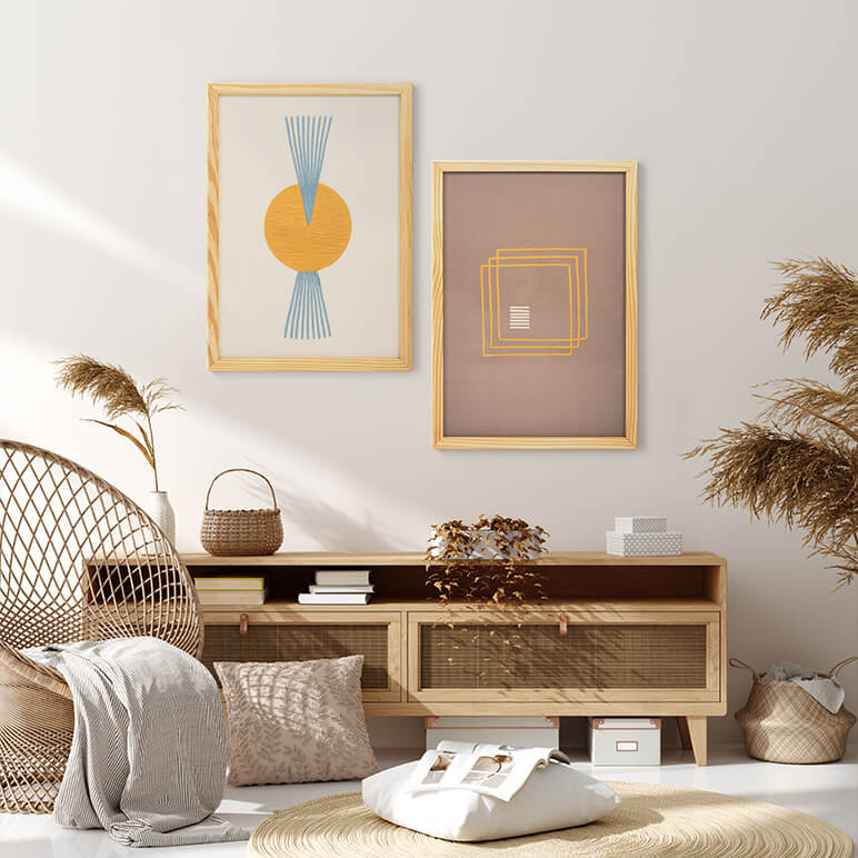 framed pair of two boho chic wall artworks featuring geometric shapes in earthy colors seen displayed in a bohemian living room