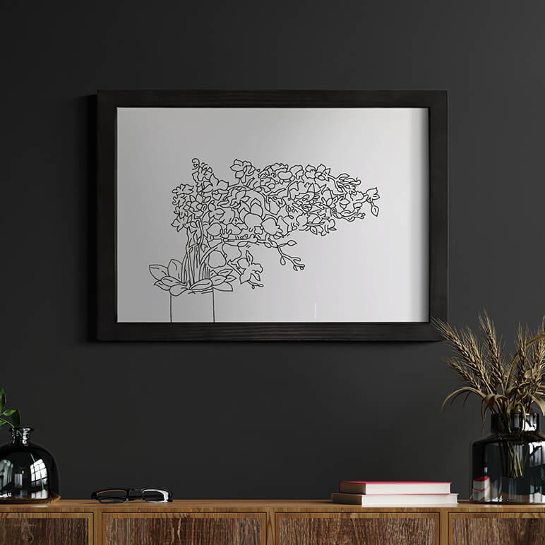 Staged image of a textile artwork featuring a modern minimalist flower vase done in line art style, framed and displayed over a dark wall