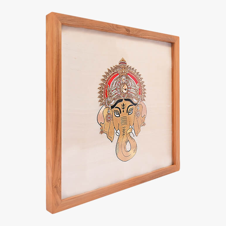Left angled view of a textile artwork showcasing Lord Ganesha, framed in wood