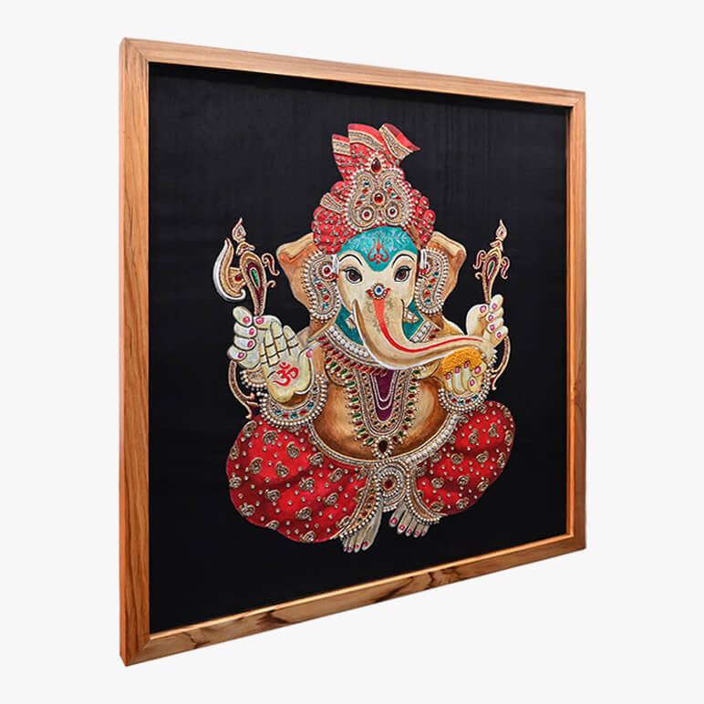 Left angled view of a Ganesha painting over a black raw silk background, framed in wood