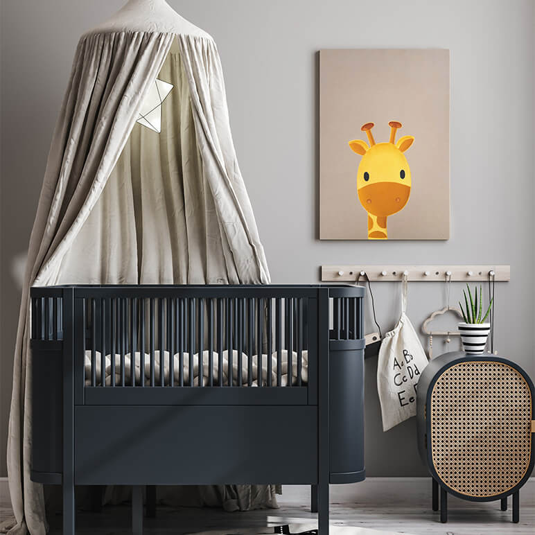 staged image of a giraffe nursery wall art seen displayed in a grey toned nursery