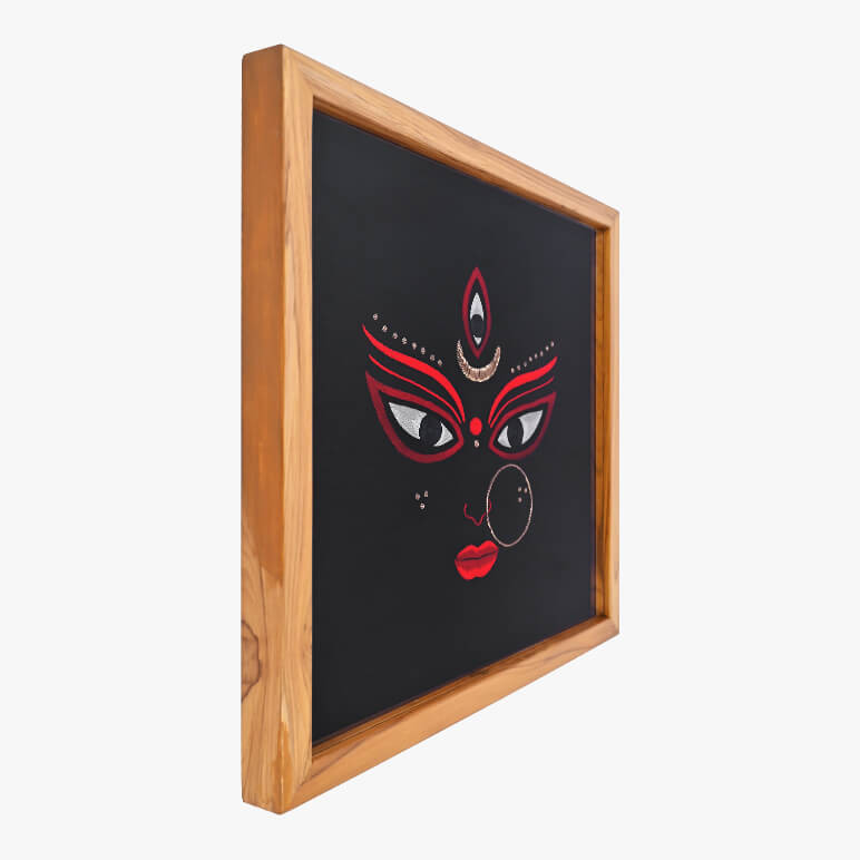 Left angled view of a Goddess Durga textile artwork, framed in wood