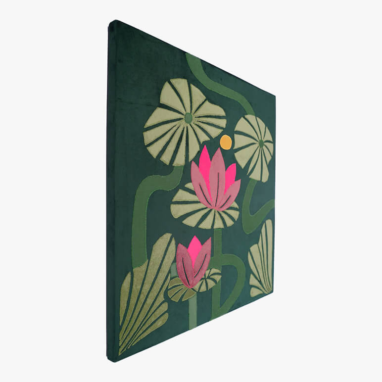 Left angled view of a tropical green artwork, canvas framed, featuring pink lotuses with green stalks over a dark green soft suede background