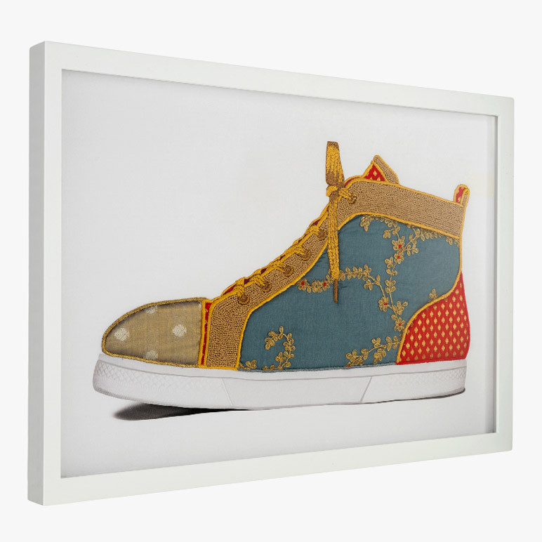 side view of framed home office wall art with a blue sneaker