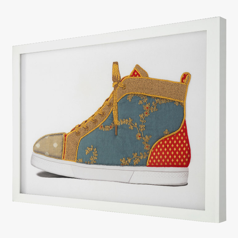side view of a framed floral blue sneaker wall art for office