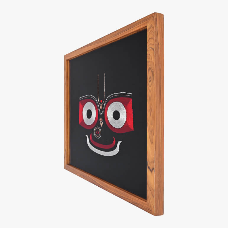 Right angle view of Jagannath art framed in a wooden frame