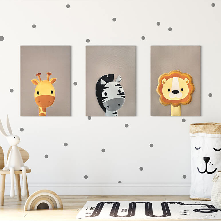 staged view of a nursery showcasing various jungle safari themed wall artworks