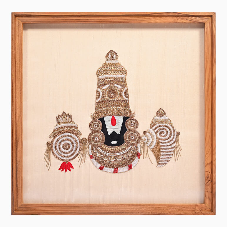 Textile artwork of Lord Venkateswara, hand-embroidered using beads, crystals, French purl wire and silk thread over a cream raw silk background, framed in wood