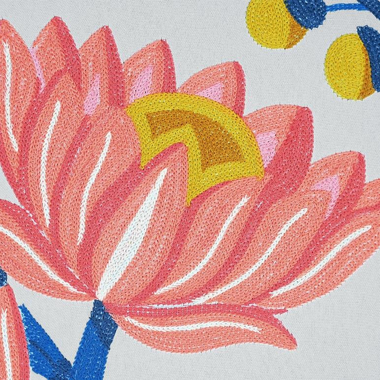 Detailed view of a lotus art showing the embroidery details in pink, blue and yellow colors