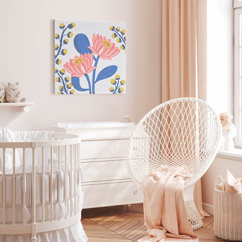 Mood shot of a canvas framed pastel blue textile lotus art seen displayed in a pink nursery room