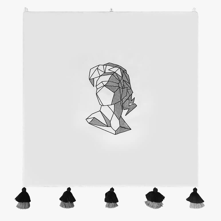 white tapestry featuring a minimalist line art with an abstract geometric female head at the center of a handloom cotton background, with black tassels at the bottom