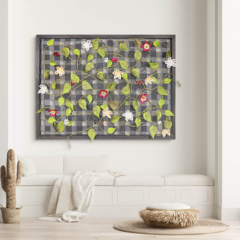 nature inspired botanical artwork seen framed in a black frame and displayed in a modern white living room with a white sofa